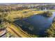 Aerial view of community with lake and golf course at 510 Canary Island Cir, Davenport, FL 33837