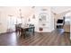 Bright dining room featuring a wood table and modern chandelier at 510 Canary Island Cir, Davenport, FL 33837