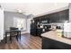 Kitchen with dark cabinetry, granite counters, and modern appliances at 510 Canary Island Cir, Davenport, FL 33837