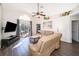 Relaxing living room with comfy sofas and access to a patio at 510 Canary Island Cir, Davenport, FL 33837