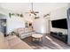 Living room with comfortable seating and a large TV at 510 Canary Island Cir, Davenport, FL 33837