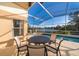 Screened-in pool area with patio furniture at 510 Canary Island Cir, Davenport, FL 33837