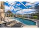 Inviting screened pool with lake view at 510 Canary Island Cir, Davenport, FL 33837