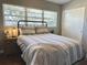 Bright bedroom with wood floors and a metal bed frame at 536 Palm Dr, Winter Garden, FL 34787