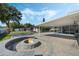 Backyard patio with fire pit and covered seating at 604 Endsley Ave, Altamonte Springs, FL 32701