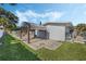 Spacious paver patio with pergola and lush landscaping at 604 Endsley Ave, Altamonte Springs, FL 32701