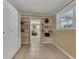 Spacious basement with built-in shelving units and access to other rooms at 604 Endsley Ave, Altamonte Springs, FL 32701