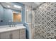 Modern bathroom with patterned tile shower and gray vanity at 604 Endsley Ave, Altamonte Springs, FL 32701