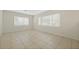 Large bedroom with tile flooring and neutral wall colors at 604 Endsley Ave, Altamonte Springs, FL 32701