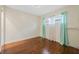 Serene bedroom with wood floors and elegant chandelier at 604 Endsley Ave, Altamonte Springs, FL 32701