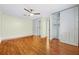 Bright bedroom with wood floors and ample closet space at 604 Endsley Ave, Altamonte Springs, FL 32701
