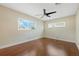 Well-lit bedroom with wood floors and window coverings at 604 Endsley Ave, Altamonte Springs, FL 32701