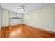 Relaxing bedroom with hardwood floors and a ceiling fan at 604 Endsley Ave, Altamonte Springs, FL 32701