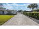 Long paver driveway leading to a gray house at 604 Endsley Ave, Altamonte Springs, FL 32701