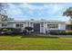 Gray house with blue door, landscaped yard, and walkway at 604 Endsley Ave, Altamonte Springs, FL 32701