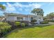 Ranch-style home with manicured lawn and shrubs at 604 Endsley Ave, Altamonte Springs, FL 32701