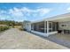 Updated home exterior with screened patio and paved driveway at 604 Endsley Ave, Altamonte Springs, FL 32701