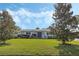 House front with lush green lawn and landscaping at 604 Endsley Ave, Altamonte Springs, FL 32701