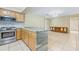 Modern kitchen featuring stainless steel appliances and granite countertops at 604 Endsley Ave, Altamonte Springs, FL 32701