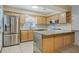 Bright kitchen with stainless steel appliances and granite countertops at 604 Endsley Ave, Altamonte Springs, FL 32701