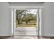 French doors open to a deck overlooking a tranquil backyard at 6424 Sleepy Hollow Dr, Orlando, FL 32810