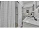 Modern bathroom with a walk-in shower and white vanity at 6424 Sleepy Hollow Dr, Orlando, FL 32810