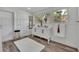 Updated bathroom features a double vanity, stylish flooring, and a large mirror at 6424 Sleepy Hollow Dr, Orlando, FL 32810