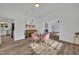 Bright dining room with glass table and pink chairs at 6424 Sleepy Hollow Dr, Orlando, FL 32810