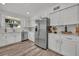 Renovated kitchen, featuring white cabinets and stainless steel appliances at 6424 Sleepy Hollow Dr, Orlando, FL 32810