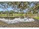 Serene lake view from the property, showcasing lush greenery at 6424 Sleepy Hollow Dr, Orlando, FL 32810