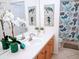 Clean bathroom with updated fixtures and ocean decor at 8103 Coconut Palm Way # 105, Kissimmee, FL 34747