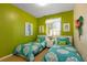 Bright bedroom with twin beds and cheerful decor at 8103 Coconut Palm Way # 105, Kissimmee, FL 34747