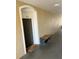 Building entrance with bench and door number at 8103 Coconut Palm Way # 105, Kissimmee, FL 34747