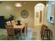 Dining area with a wooden table and six chairs at 8103 Coconut Palm Way # 105, Kissimmee, FL 34747