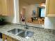Kitchen featuring a pass-through to the dining and living areas at 8103 Coconut Palm Way # 105, Kissimmee, FL 34747