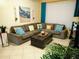 Living room with sectional sofa, creating a cozy atmosphere at 8103 Coconut Palm Way # 105, Kissimmee, FL 34747