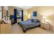 Spacious main bedroom with king-size bed and dresser at 8103 Coconut Palm Way # 105, Kissimmee, FL 34747