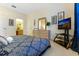 Main bedroom with king-size bed and dresser, view of bathroom at 8103 Coconut Palm Way # 105, Kissimmee, FL 34747