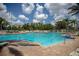 Large community pool with plenty of lounge chairs at 8103 Coconut Palm Way # 105, Kissimmee, FL 34747