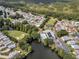 Aerial view of community with lake and clubhouse at 843 Challenger Ave, Davenport, FL 33897