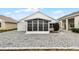 Single story home with screened porch and gravel yard at 843 Challenger Ave, Davenport, FL 33897