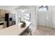 Kitchen with stainless steel appliances and view into dining area at 843 Challenger Ave, Davenport, FL 33897