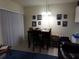 Dining area with table and chairs, adjacent to living room at 110 Cypress Woods Ct # 5C, Deltona, FL 32725
