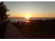 Scenic sunset view of lakefront park with people enjoying the evening at 110 Cypress Woods Ct # 5C, Deltona, FL 32725