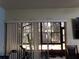 View of backyard from living room, featuring sliding glass doors at 110 Cypress Woods Ct # 5C, Deltona, FL 32725