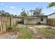 Backyard with wooden fence and small tree at 1103 Errol Place Cir, Apopka, FL 32712