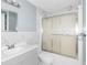 Recently updated bathroom with gray vanity and marble tile at 1103 Errol Place Cir, Apopka, FL 32712