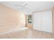 Bedroom with ceiling fan, window, and sliding door closet at 1103 Errol Place Cir, Apopka, FL 32712