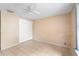 Large bedroom with tile floors and mirrored closet doors at 1103 Errol Place Cir, Apopka, FL 32712