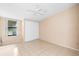 Bedroom with ceiling fan, window, and sliding door closet at 1103 Errol Place Cir, Apopka, FL 32712